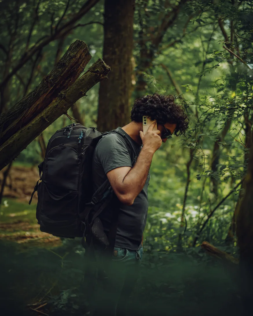 Man answering a phone call outdoors